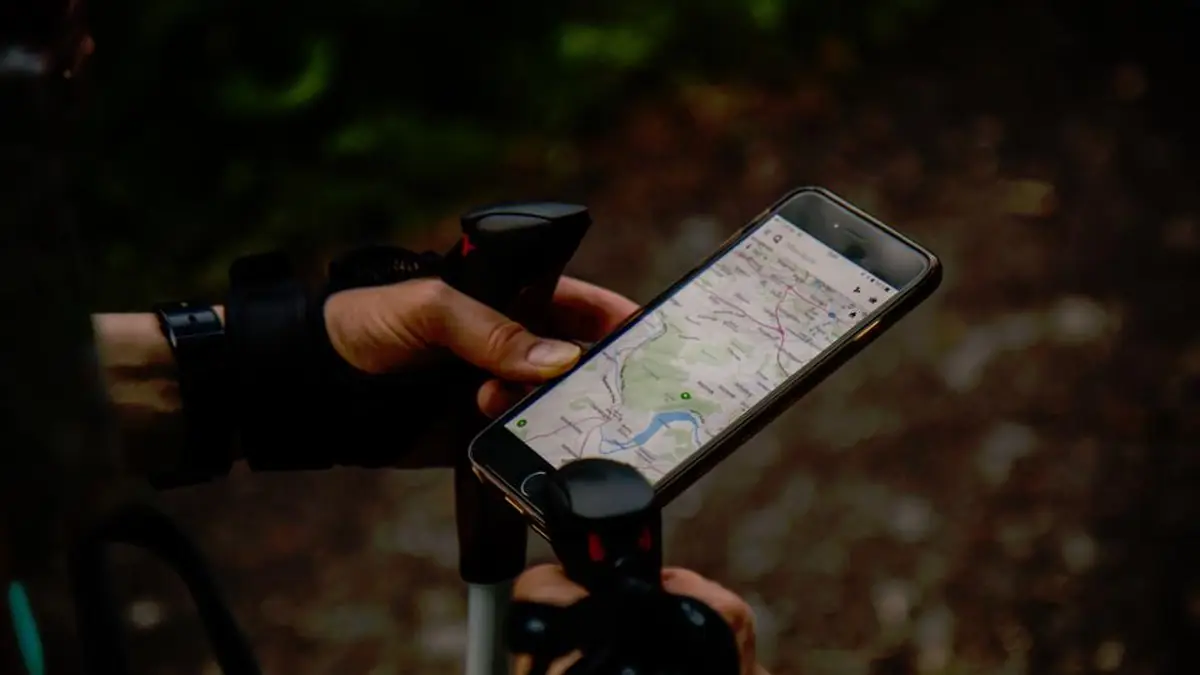 Hands holding a smartphone showing a map app with local listings