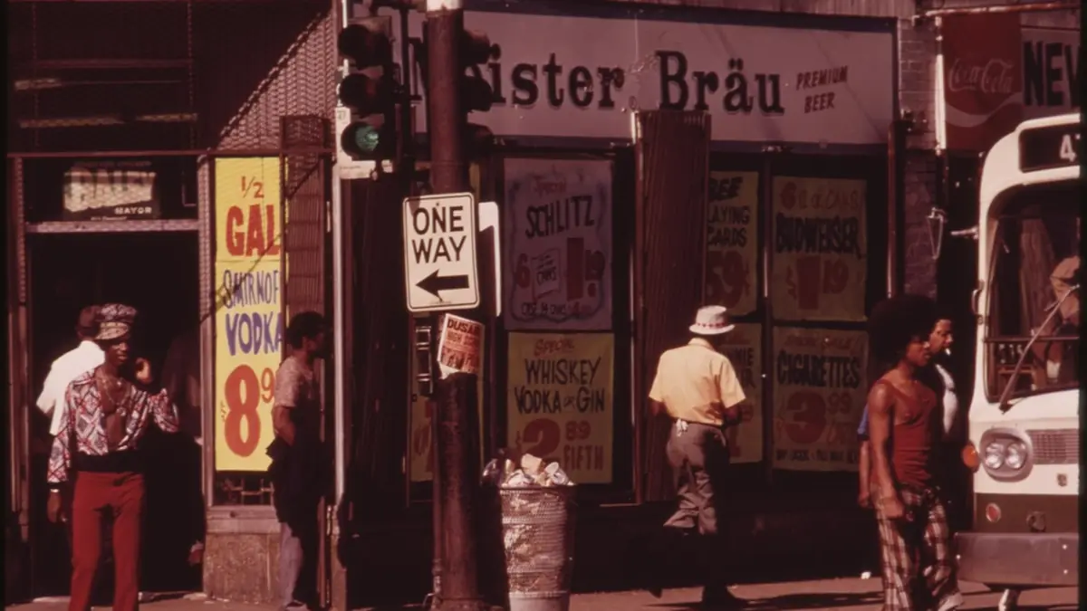 City street with pedestrians walking past local businesses