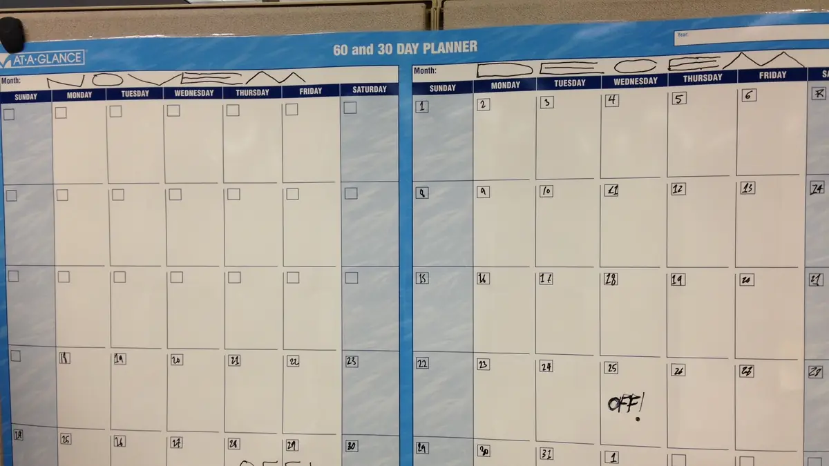 Wall calendar filled with scheduled appointments and notes