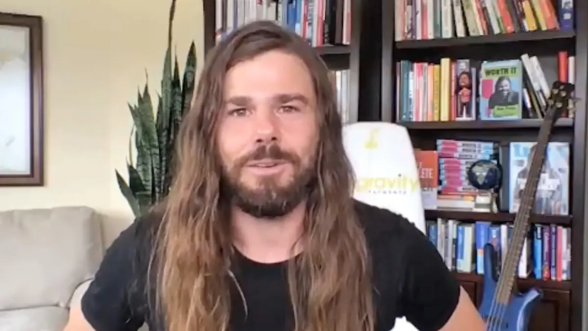 Man speaking to the camera as if sharing a customer testimonial