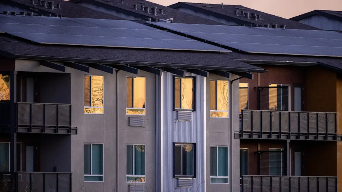 Apartment building with solar panels on the roof